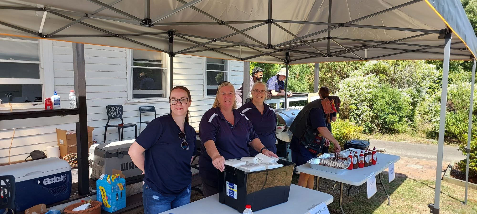 Curamus team at a community BBQ event